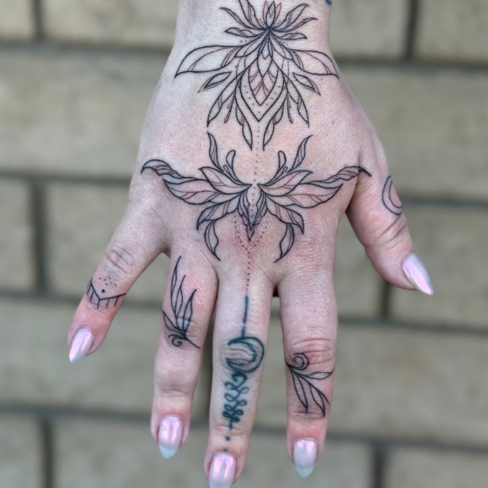 Fine Line Hand Tattoo