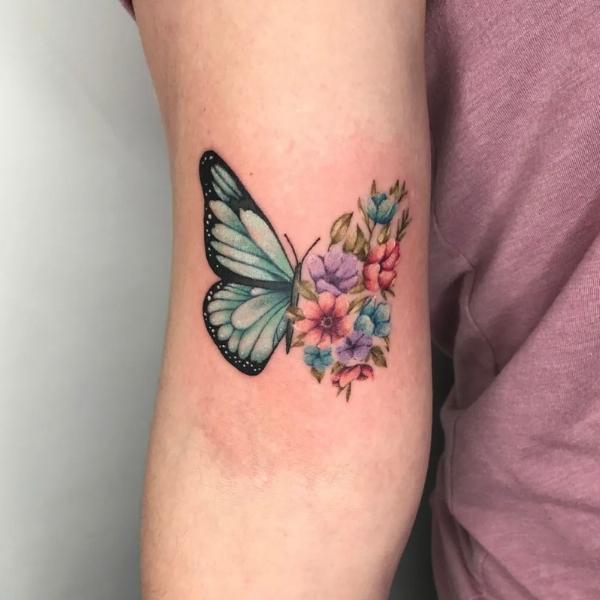 Tattoo uploaded by alex panda  Small butterfly design with flowers black  worksimple and clean  Tattoodo